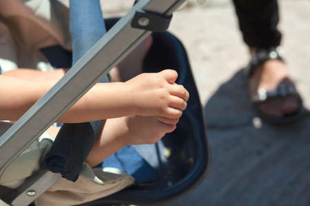 the child in the stroller in the streetの写真素材