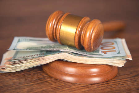 judge and money on the wooden table