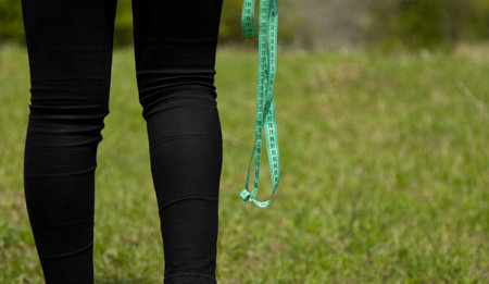 training woman hand meters in nature backgroundの写真素材