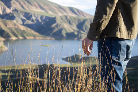 man hand tobacco in mountain background