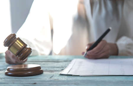 woman Judge working in document on the table