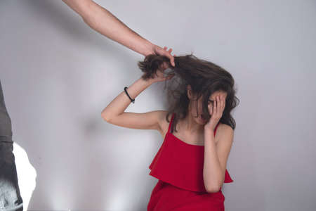 angry man beating young sad womanの写真素材