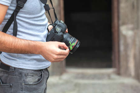 camera in the photographer's hand in the streetの写真素材