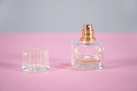 women's perfume on the pink table