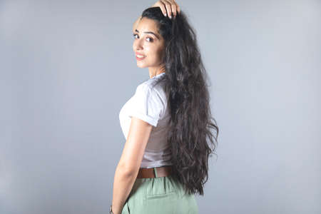 happy young woman hand in long hairの写真素材