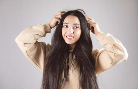 young happy woman hand in hoodの写真素材