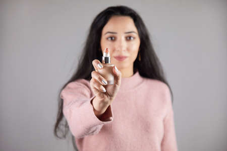 young woman hand bottle foundationの写真素材