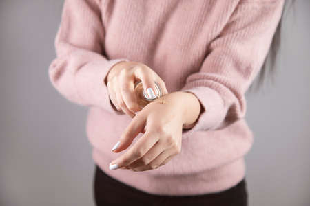 young woman hand bottle foundationの写真素材