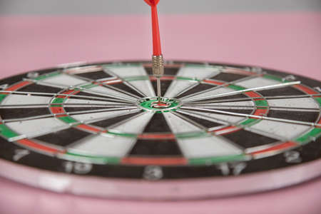 arrow on target on pink backgroundの写真素材