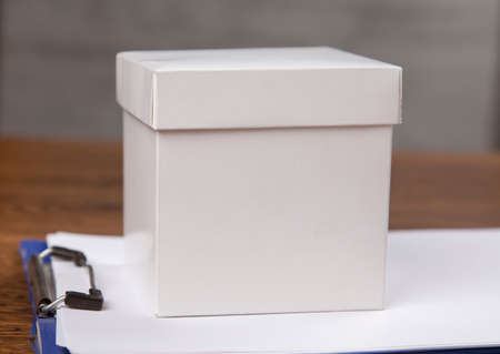 white box on the document on table