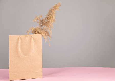 vintage shopping bag and grass on table