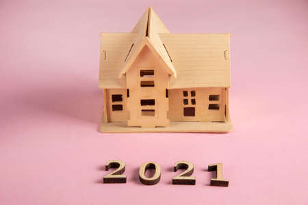 wooden 2021 and house model on table
