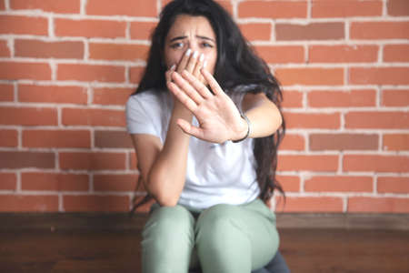 sad young woman hand stop sign