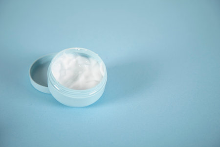 face cream on the blue table backgroundの写真素材