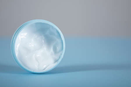 face cream on the blue table backgroundの写真素材