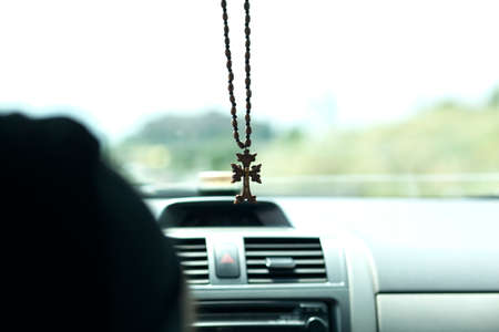 wooden cross in the carの写真素材
