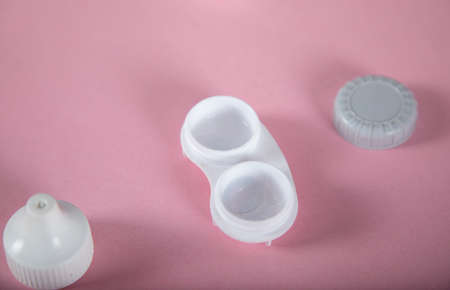 optical lenses on the pink tableの写真素材