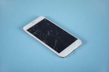 broken phone on the table background