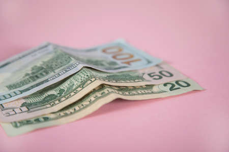 money on the pink table background