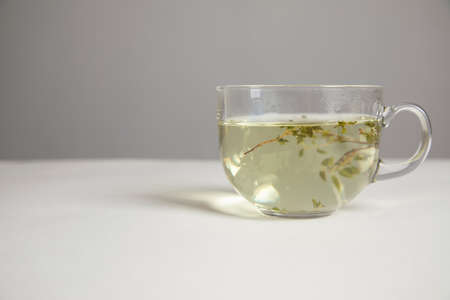 Glass cup of hot aromatic herbal tea.の写真素材