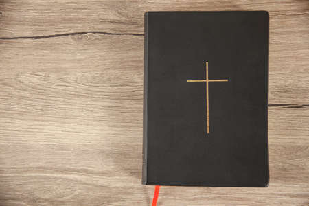 Holy Bible on the wooden table background