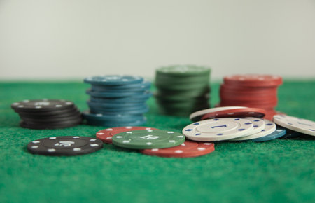 poker chips on the green table background