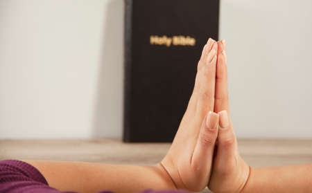 The young prayer woman holding Bible.の写真素材