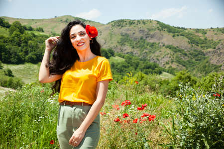 young happy woman poppy on the headの写真素材
