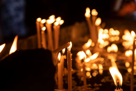 People light candles in the church.の写真素材