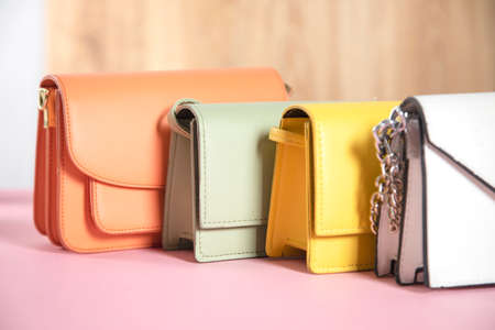 fashion color bags on the pink tableの写真素材