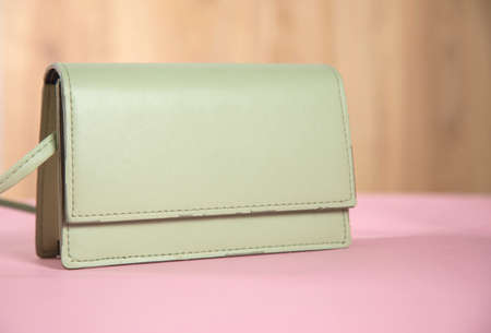 fashion green bag on the tableの写真素材