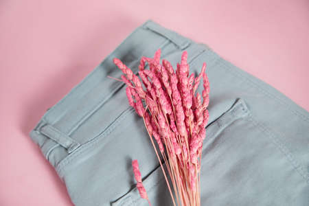 pink decoration flower on the jeansの写真素材