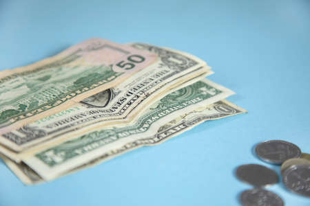 dollar with coins on the tableの写真素材