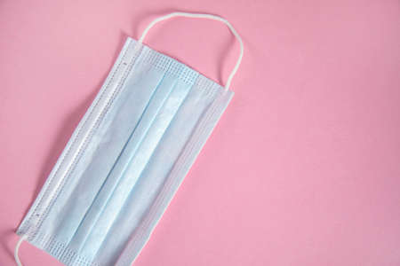 medical mask on the pink table backgroundの写真素材