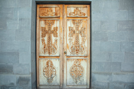 Wooden doors of a Christian church.の写真素材
