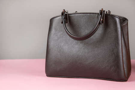elegant black bags on the pink backgroundの写真素材