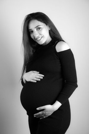 Pregnant woman hand on the belly.の写真素材