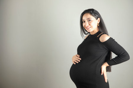 Pregnant woman hand on the belly.の写真素材