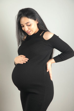 Pregnant woman hand on the belly.の写真素材