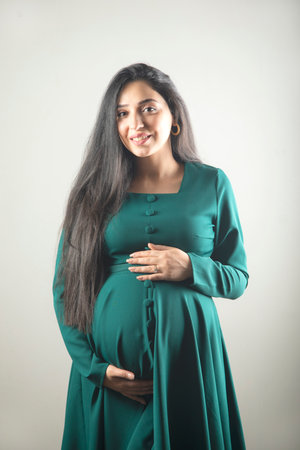 Pregnant woman hand on the belly.の写真素材