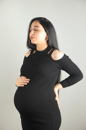 Pregnant woman hand on the belly.の写真素材