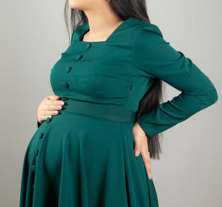 Pregnant woman hand on the belly.の写真素材