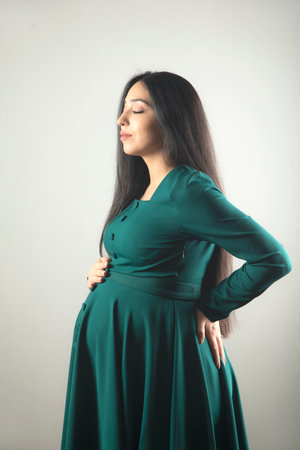 Pregnant woman hand on the belly.の写真素材