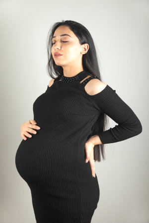 Pregnant woman hand on the belly.の写真素材