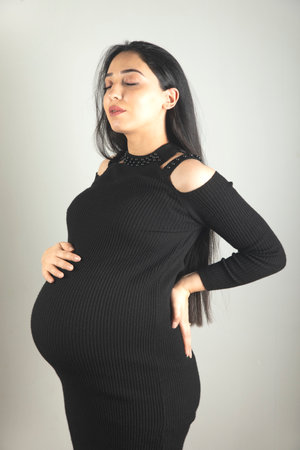 Pregnant woman hand on the belly.の写真素材