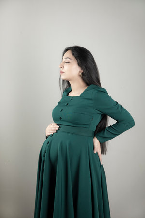 Pregnant woman hand on the belly.の写真素材