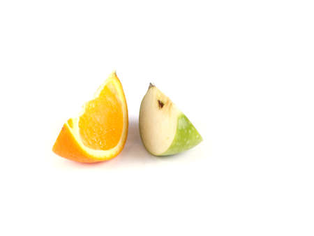 Fruit composition of slices of apple and orange on a white backgroundの写真素材