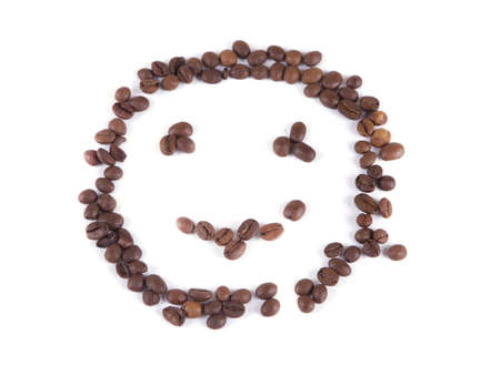 composition of coffee beans in the form of a smiley on a white backgroundの写真素材