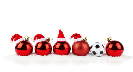 Red christmas balls with santa claus hat isolated on white backgroundの素材