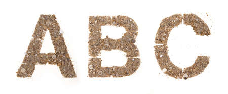 stones and sands letters isolated on whiteの写真素材